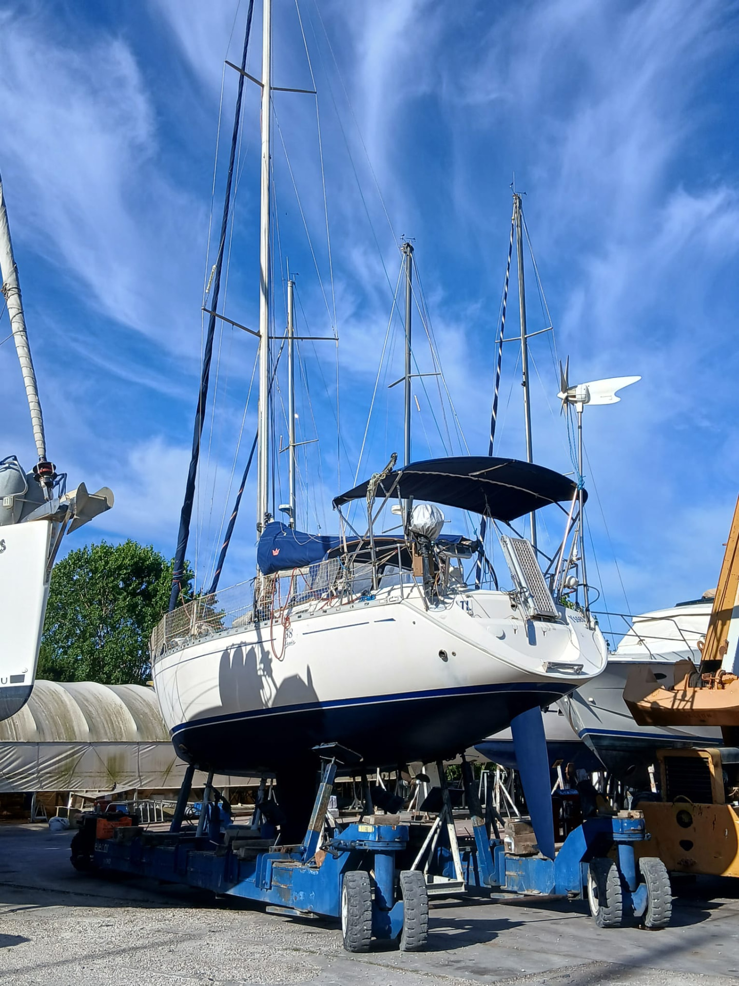 Sailing yachts wintering ashore on stands in an Italian boatyard
